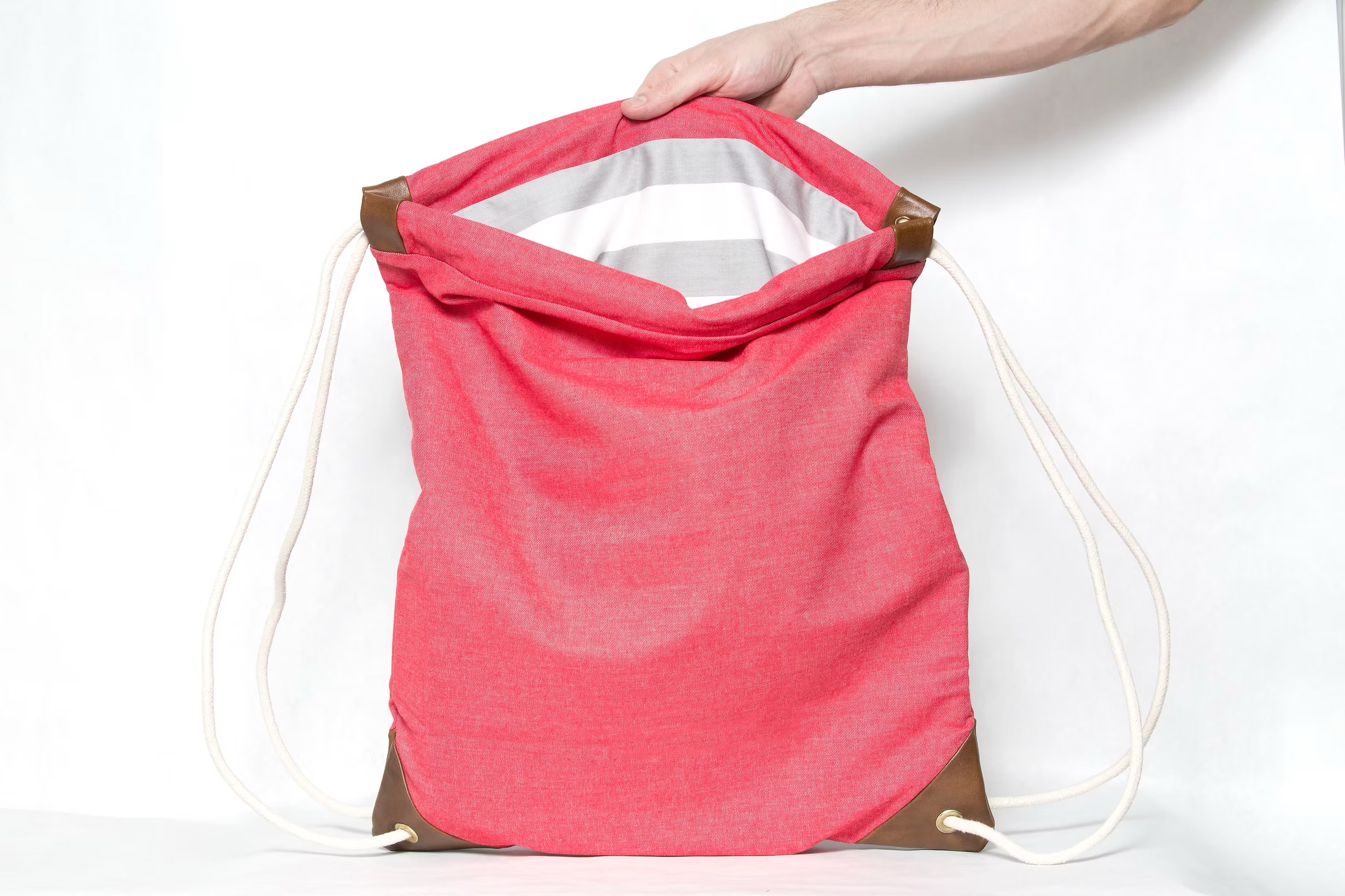 pacific coral red light denim drawstring bag with stripe lining handmade in brooklyn
