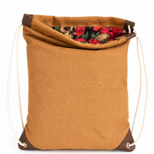 stockholm tan perforated suede drawstring bag with floral skull lining handmade in brooklyn