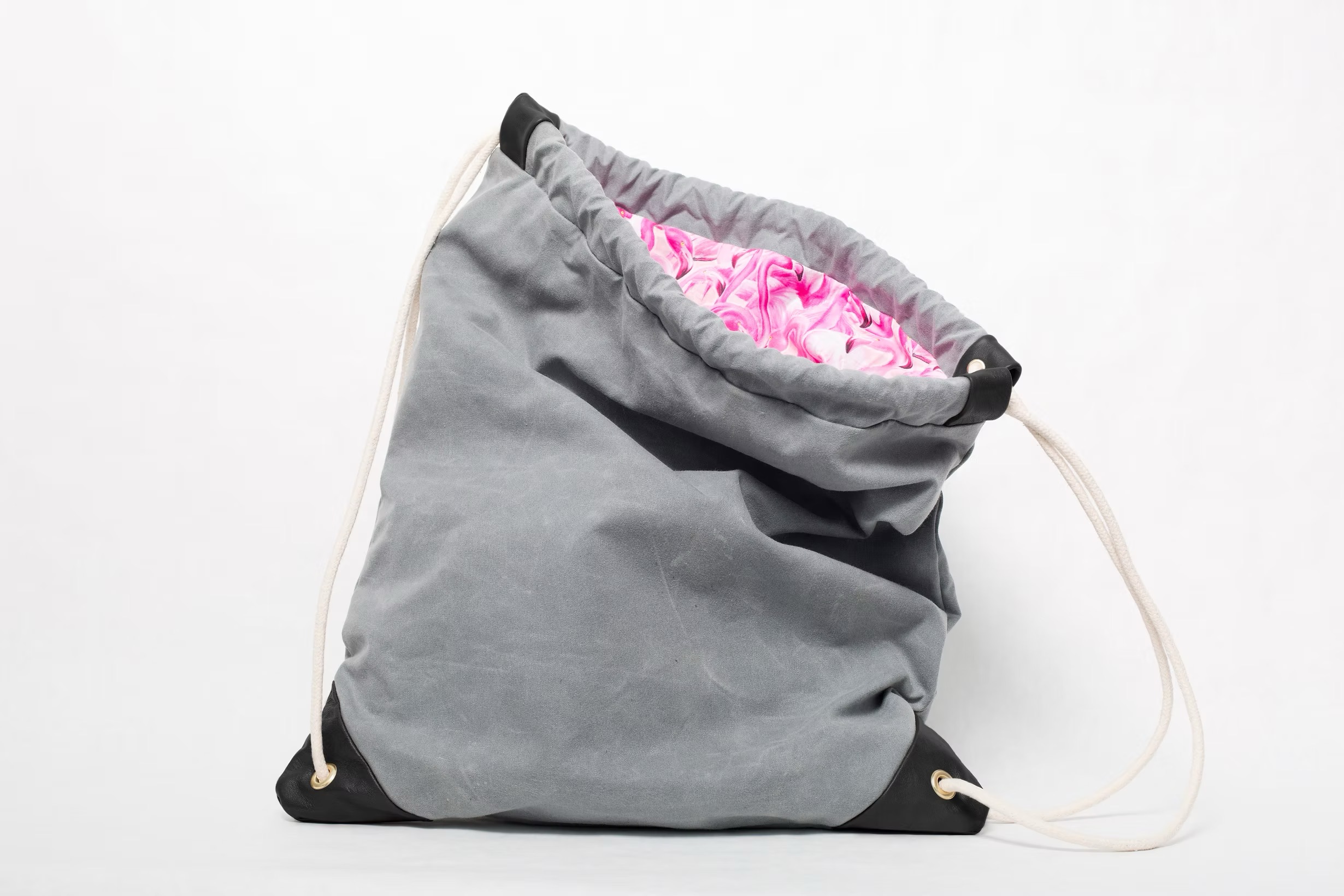 west end grey waxed canvas drawstring bag with pink flamingo lining handmade in brooklyn